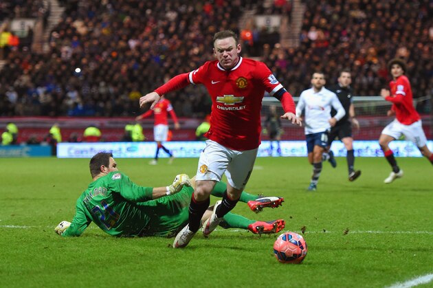 PRESTON, ENGLAND - FEBRUARY 16:  Wayne Rooney of Manchester United draws a foul from Thorsten Stuckmann of Preston North End to win a penalty during the FA Cup Fifth round match between Preston North End and Manchester United at Deepdale on February 16, 2015 in Preston, England  (Photo by Michael Regan/Getty Images)