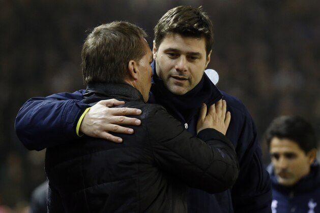 Liverpool manager Brendan Rodgers, left, and Tottenham manager Mauricio Pochettino greet each other ahead of the English Premier League soccer match between Liverpool and Tottenham Hotspur at Anfield Stadium, Liverpool, England, Tuesday Feb. 10, 2015. (AP Photo/Jon Super)