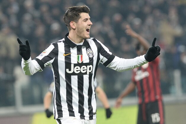 Juventus forward Alvaro Morata celebrates after scoring his side's third goal during a Serie A soccer match between Juventus and AC Milan at the Juventus stadium, in Turin, Italy, Sunday, Feb. 7, 2015. (AP Photo/Massimo Pinca)