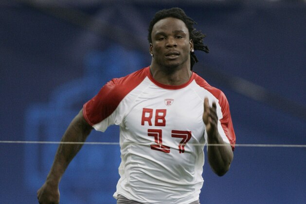 Running back Chris Johnson, of East Carolina, runs the 40-yard dash at the NFL Combine in Indianapolis, Sunday, Feb. 24, 2008.  (AP Photo/Michael Conroy)