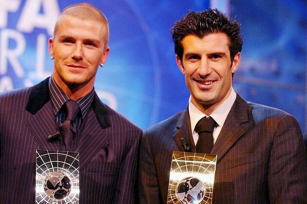 David Beckham, left, of Manchester United, Portuguese player Luis Figo, center, of Spanish team Real Madrid, and Raul of Real Madrid, pose with their trophies following the FIFA award ceremony in Zurich, Switzerland, on Monday, Dec. 17, 2001. Figo was awarded FIFA