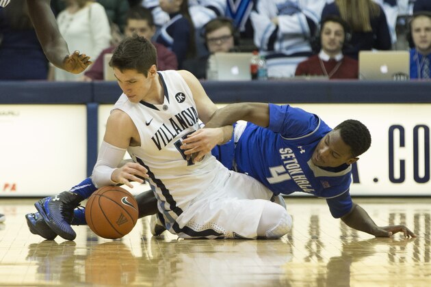 VILLANOVA, PA - FEBRUARY 16: Ryan Arcidiacono #15 of the Villanova Wildcats wrestles for the ball with Sterling Gibbs #4 of the Seton Hall Pirates on February 16, 2015 at the Pavilion in Villanova, Pennsylvania.  The Wildcats defeated the Pirates 80-54 (Photo by Mitchell Leff/Getty Images)