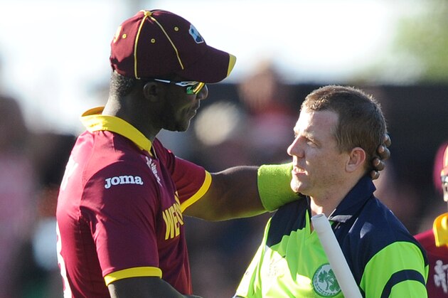 Ireland's Niall O'Brien, right, shakes hands with West Indies' Darren Sammy at the end of their Cricket World Cup pool B match at Nelson, New Zealand, Monday, Feb. 16, 2015. Ireland wins the match with 4 wickets and 25 balls to spare. (AP Photo/Ross Setford)