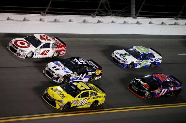 DAYTONA BEACH, FL - FEBRUARY 14: Kyle Larson, driver of the #42 Target Chevrolet, races Tony Stewart, driver of the #14 Mobil 1/Bass Pro Shops Chevrolet, and Matt Kenseth, driver of the #20 Dollar General Toyota, ahead of Casey Mears, driver of the #13 GEICO Chevrolet, and Denny Hamlin, driver of the #11 FedEx Express Toyota, during the 3rd Annual Sprint Unlimited at Daytona at Daytona International Speedway on February 14, 2015 in Daytona Beach, Florida.  (Photo by Matt Sullivan/Getty Images)
