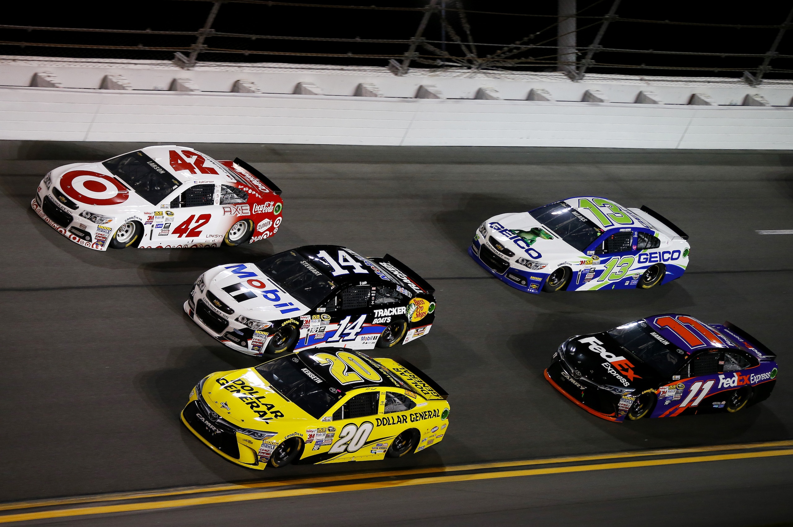 DAYTONA BEACH, FL - FEBRUARY 14: Kyle Larson, driver of the #42 Target Chevrolet, races Tony Stewart, driver of the #14 Mobil 1/Bass Pro Shops Chevrolet, and Matt Kenseth, driver of the #20 Dollar General Toyota, ahead of Casey Mears, driver of the #13 GEICO Chevrolet, and Denny Hamlin, driver of the #11 FedEx Express Toyota, during the 3rd Annual Sprint Unlimited at Daytona at Daytona International Speedway on February 14, 2015 in Daytona Beach, Florida.  (Photo by Matt Sullivan/Getty Images)
