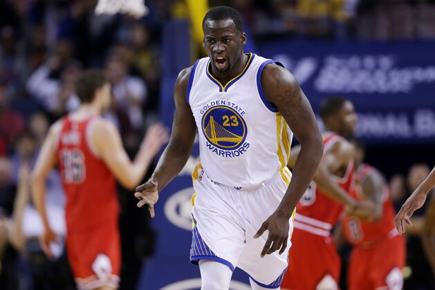 Golden State Warriors' Draymond Green (23) celebrates after making a three-point basket against the Chicago Bulls during the first half of an NBA basketball game Tuesday, Jan. 27, 2015, in Oakland, Calif. (AP Photo/Marcio Jose Sanchez)