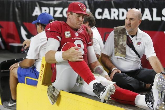 Arizona Cardinals quarterback Carson Palmer (3) leaves the field after injuring his left knee against the St. Louis Rams during the second half of an NFL football game, Sunday, Nov. 9, 2014, in Glendale, Ariz. (AP Photo/Rick Scuteri)