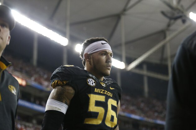 Missouri defensive lineman Shane Ray (56) walks off the field after being ejected from the game for a late hit against Alabama quarterback Blake Sims during the first half of the Southeastern Conference championship NCAA college football game, Saturday, Dec. 6, 2014, in Atlanta. (AP Photo/Brynn Anderson)