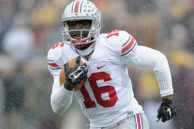 MINNEAPOLIS, MN - NOVEMBER 15: J.T. Barrett #16 of the Ohio State Buckeyes carries the football against the Minnesota Golden Gophers during the second quarter of the game on November 15, 2014 at TCF Bank Stadium in Minneapolis, Minnesota. (Photo by Hannah Foslien/Getty Images)