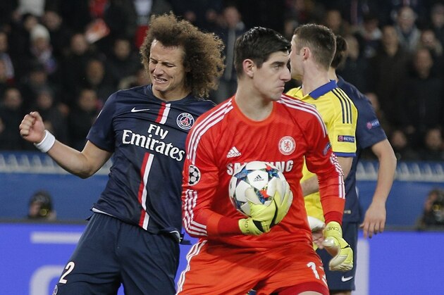 PSG's David Luiz reacts as Chelsea's goalkeeper Thibaut Courtois catches the ball during the Champions League round of 16 first leg soccer match between Paris Saint Germain and Chelsea at the Parc des Princes stadium in Paris, France, Tuesday, Feb. 17, 2015. (AP Photo/Christophe Ena)