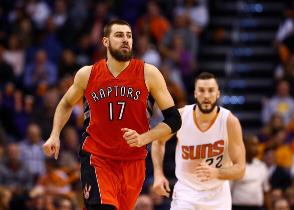 Jan 4, 2015; Phoenix, AZ, USA; Toronto Raptors center center Jonas Valanciunas (17) and Phoenix Suns center Miles Plumlee (22) at US Airways Center. The Suns defeated the Raptors 125-109. Mandatory Credit: Mark J. Rebilas-USA TODAY Sports