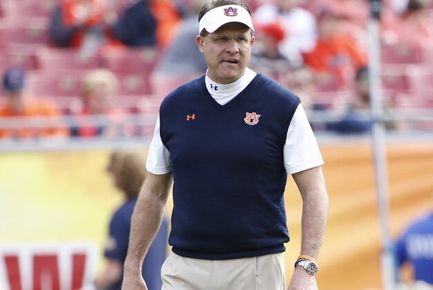 TAMPA, FL - JANUARY 1:   Head coach Gus Malzahn of the Auburn Tigers looks over his players as they warm up before the start of the Outback Bowl against the Wisconsin Badgers on January 1, 2015 at Raymond James Stadium in Tampa, Florida.  (Photo by Brian Blanco/Getty Images)