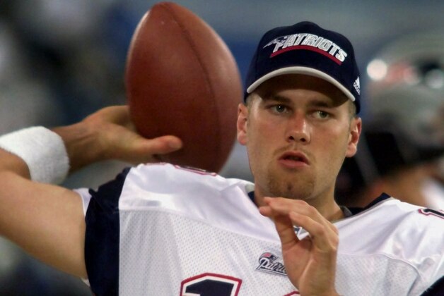 New England Patriots backup quarterback Tom Brady warms up on the sidelines before the game against the Detroit Lions at the Silverdome in Pontiac, Mich., Friday, Aug. 4, 2000. Brady is a former starting quarterback at the University of Michigan. (AP Photo/Carlos Osorio)