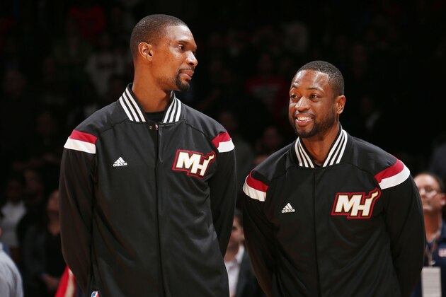 WASHINGTON,DC - December 1: Chris Bosh #1 and Dwyane Wade #3 of the Miami Heat stand on the court before the national anthem before the game against the Washington Wizards on December 1, 2014 at Verizon Center in Washington, DC. NOTE TO USER: User expressly acknowledges and agrees that, by downloading and or using this Photograph, user is consenting to the terms and conditions of the Getty Images License Agreement. Mandatory Copyright Notice: Copyright 2014 NBAE (Photo by Ned Dishman/NBAE via Getty Images)