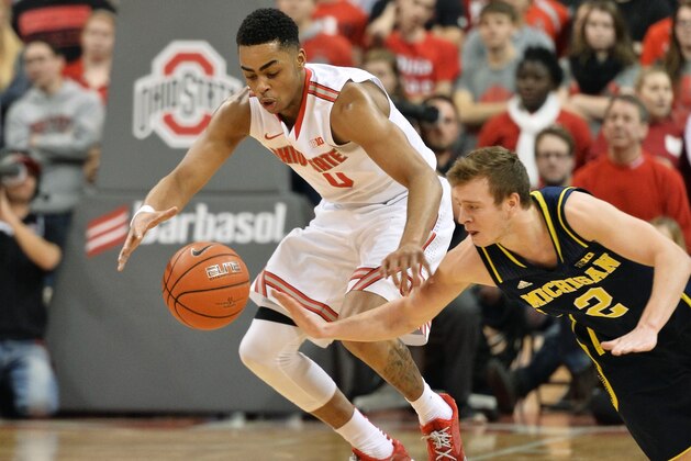 COLUMBUS, OH - JANUARY 13:  D'Angelo Russell #0 of the Ohio State Buckeyes and Spike Albrecht #2 of the Michigan Wolverines battle for control of a loose ball in the second half on January 13, 2015 at Value City Arena in Columbus, Ohio. Ohio State defeated Michigan 71-52.  (Photo by Jamie Sabau/Getty Images)