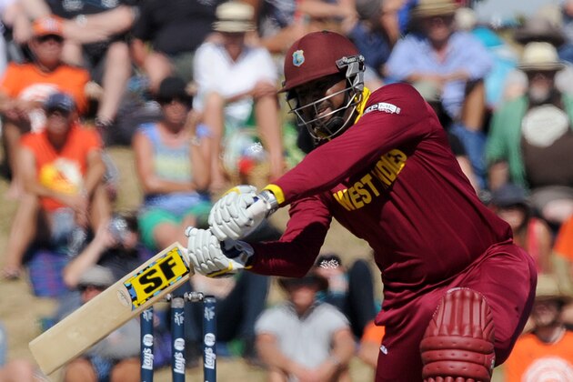 West Indies' Dwayne Smith drives the ball against Ireland during their Cricket World Cup pool B match at Nelson, New Zealand, Monday, Feb. 16, 2015. (AP Photo/Ross Setford)
