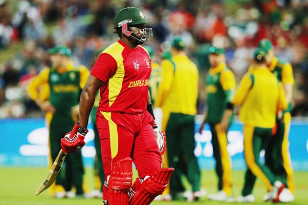 HAMILTON, NEW ZEALAND - FEBRUARY 15: Hamilton Masakadza of Zimbabwewalks off after being dismissed by Muhammad Imran Tahir of South Africa during the 2015 ICC Cricket World Cup match between South Africa and Zimbabwe at Seddon Park on February 15, 2015 in Hamilton, New Zealand.  (Photo by Hannah Peters/Getty Images)