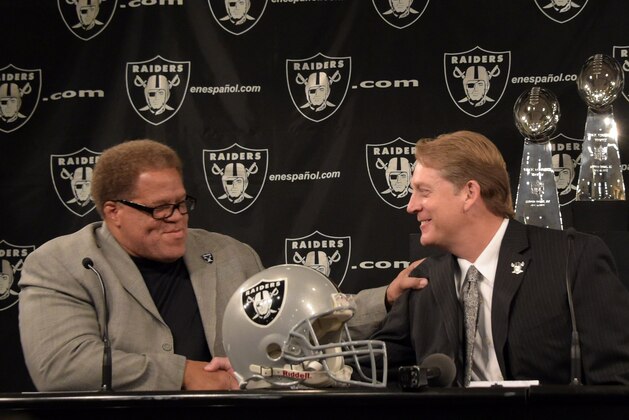 Jan 16, 2015; Alameda, CA, USA; Jack Del Rio (right) shakes hands with Oakland Raiders general manager Reggie McKenzie at press conference to announce his hiring as Raiders head coach at the Raiders practice facility. Mandatory Credit: Kirby Lee-USA TODAY Sports