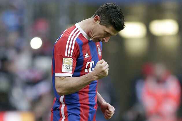 Bayern's Robert Lewandowski from Poland celebrates after scoring his side's sixth goal during the German first division Bundesliga soccer match between FC Bayern Munich and Hamburger SV in the Allianz Arena in Munich, Germany, Saturday, Feb. 14, 2015. (AP Photo/Matthias Schrader)