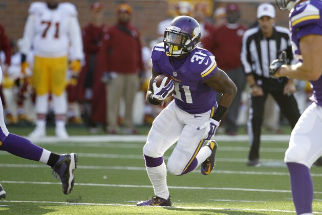 Minnesota Vikings running back Jerick McKinnon (31) carries the ball during the second half of an NFL football game against the Washington Redskins, Sunday, Nov. 2, 2014, in Minneapolis. (AP Photo/Ann Heisenfelt)