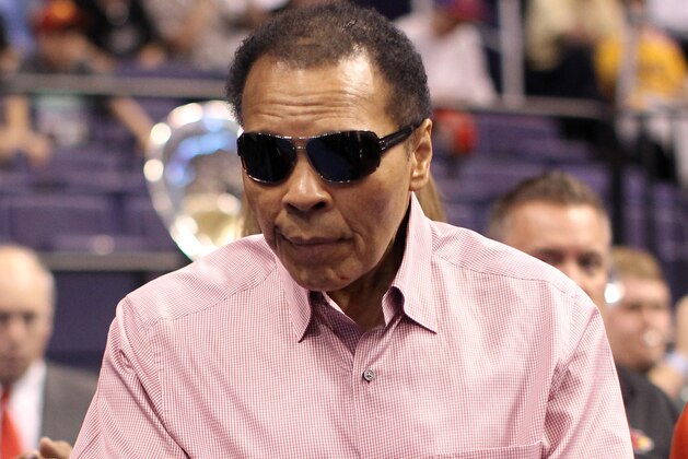 PHOENIX, AZ - MARCH 22:  Boxing legend and Louisville native Muhammad Ali walks into US Airways Center to watch the Louisville Cardinals take on the Michigan State Spartans during the 2012 NCAA Men's Basketball West Regional Semifinal game at US Airways Center on March 22, 2012 in Phoenix, Arizona.  (Photo by Christian Petersen/Getty Images)
