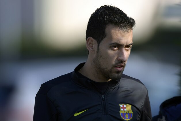 FC Barcelona's Sergio Busquets arrives for a press conference at the Sports Center FC Barcelona Joan Gamper in San Joan Despi, Spain, Tuesday, Dec. 10, 2013. FC Barcelona will play against Celtic in a group H Champions League next Wednesday 11 Dec. (AP Photo/Manu Fernandez)