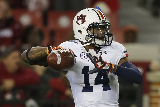 Auburn quarterback Nick Marshall (14) warms up before the first half of the Iron Bowl NCAA college football game against Alabama, Saturday, Nov. 29, 2014, in Tuscaloosa, Ala. (AP Photo/Mike Stewart)