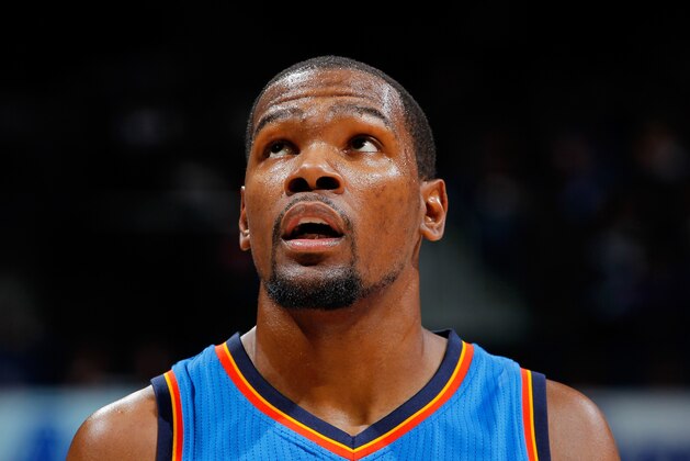 ATLANTA, GA - JANUARY 23:  Kevin Durant #35 of the Oklahoma City Thunder reacts during the game against the Atlanta Hawks at Philips Arena on January 23, 2015 in Atlanta, Georgia.  NOTE TO USER: User expressly acknowledges and agrees that, by downloading and or using this photograph, User is consenting to the terms and conditions of the Getty Images License Agreement.  (Photo by Kevin C. Cox/Getty Images)