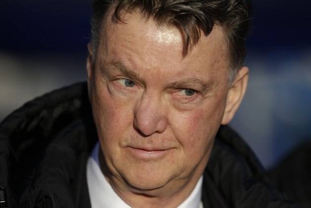 Manchester United's manager Louis van Gaal waits for the start of the English Premier League soccer match between QPR and Manchester United at Loftus Road stadium in London, Saturday, Jan. 17, 2015.  (AP Photo/Matt Dunham)