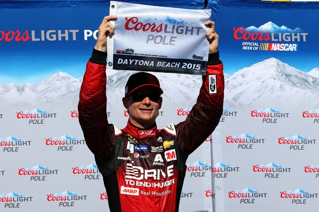 DAYTONA BEACH, FL - FEBRUARY 15:  Jeff Gordon, driver of the #24 Drive To End Hunger Chevrolet, poses with the Coors Light Pole Award after qualifying for the pole position for the 57th Annual Daytona 500 at Daytona International Speedway on February 15, 2015 in Daytona Beach, Florida.  (Photo by Chris Graythen/Getty Images)