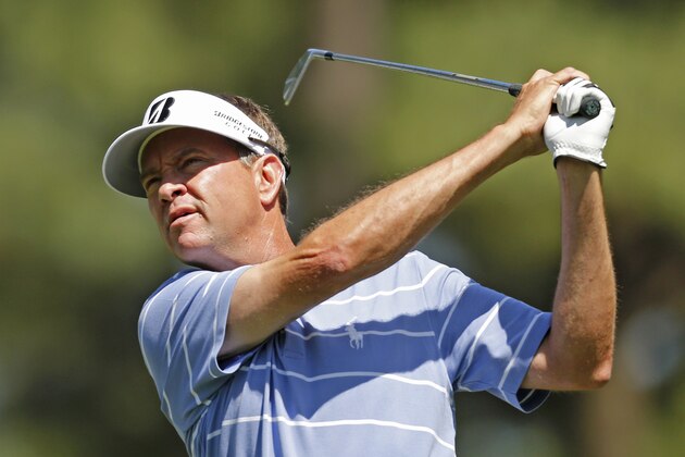 Davis Love III watches his tee shot on the fourth hole during the second round of the Wells Fargo Championship golf tournament in Charlotte, N.C., Friday, May 2, 2014. (AP Photo/Nell Redmond)