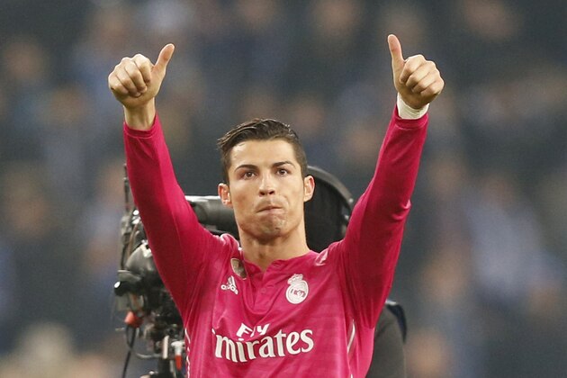 Real Madrid's Cristiano Ronaldo gives thumb-up after winning 2-0 during the Champions League round of 16 first leg soccer match between FC Schalke 04 and Real Madrid on Wednesday, Feb. 18, 2015 in Gelsenkirchen, Germany. (AP Photo/Frank Augstein)