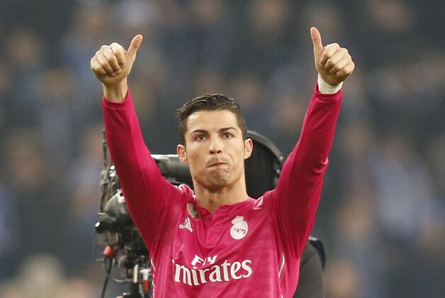 Real Madrid's Cristiano Ronaldo gives thumb-up after winning 2-0 during the Champions League round of 16 first leg soccer match between FC Schalke 04 and Real Madrid on Wednesday, Feb. 18, 2015 in Gelsenkirchen, Germany. (AP Photo/Frank Augstein)