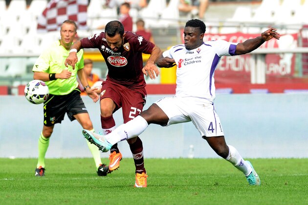 TURIN, ITALY - SEPTEMBER 28: (L-R) Fabio Quagliarella of Torino FC competes for the ball against Micah Richards of AFC Fiorentina during the Serie A match between Torino FC and ACF Fiorentina at Stadio Olimpico di Torino on September 28, 2014 in Turin, Italy.  (Photo by Pier Marco Tacca/Getty Images)