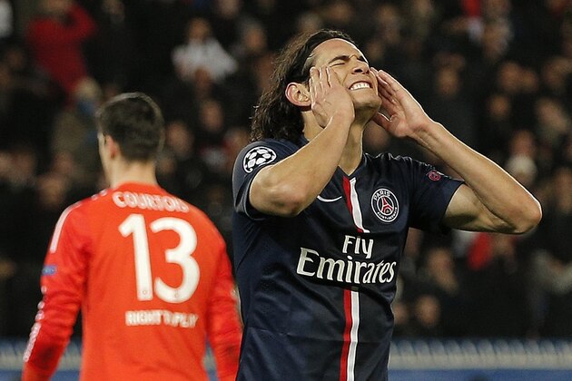 PSG's Edinson Cavani reacts after missing a chance during the Champions League round of 16 first leg soccer match between Paris Saint Germain and Chelsea at the Parc des Princes stadium in Paris, France, Tuesday, Feb. 17, 2015. (AP Photo/Christophe Ena)