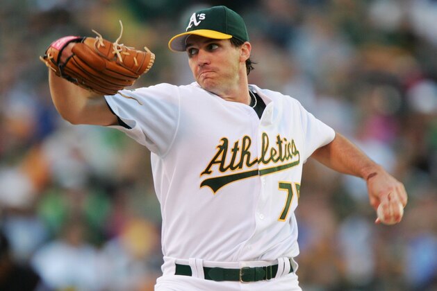 OAKLAND, CA - OCTOBER 10:  Starting pitcher Barry Zito #75 of the Oakland Athletics pitches against the Detroit Tigers during Game One of the American League Championship Series on October 10, 2006 at McAfee Coliseum in Oakland, California.   (Photo by Jed Jacobsohn/Getty Images)