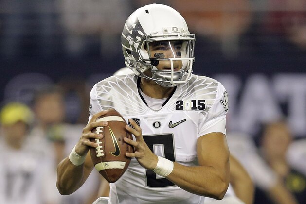 Oregon's Marcus Mariota during the first half of the NCAA college football playoff championship game against Ohio State Monday, Jan. 12, 2015, in Arlington, Texas. (AP Photo/Eric Gay)