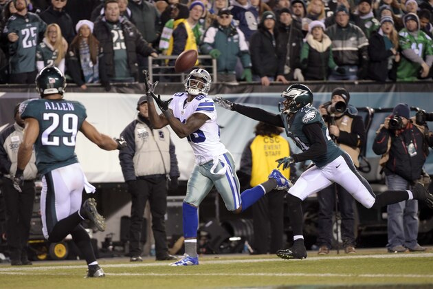 Dec 14, 2014; Philadelphia, PA, USA; Dallas Cowboys wide receiver Dez Bryant (88) catches a pass for a touchdown as Philadelphia Eagles strong safety Nate Allen (29) and cornerback Bradley Fletcher (24) defend in the fourth quarter at Lincoln Financial Field. Mandatory Credit: Eric Hartline-USA TODAY Sports