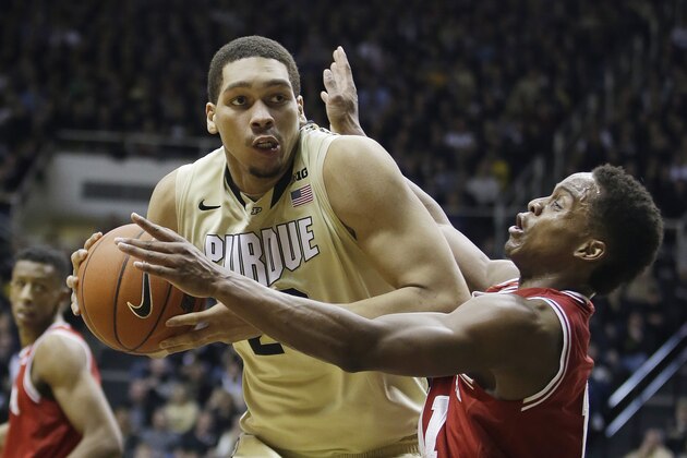 Indiana's Yogi Ferrell (11) is called for a foul as Purdue's A.J. Hammons goes up for a shot during the second half of an NCAA college basketball game Wednesday, Jan. 28, 2015, in West Lafayette, Ind. Purdue won 83-67. (AP Photo/Darron Cummings)