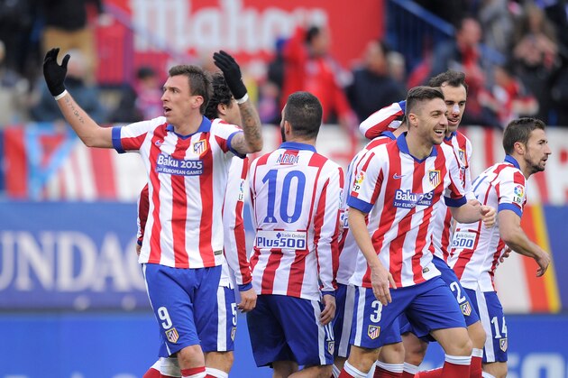 MADRID, SPAIN - FEBRUARY 07:  Mario Mandzukic of Club Atletico de Madrid celebrates after scoring his team's 4th goal during the La Liga match between Club Atletico de Madrid and Real Madrid at Vicente Calderon Stadium on February 7, 2015 in Madrid, Spain.  (Photo by Denis Doyle/Getty Images)