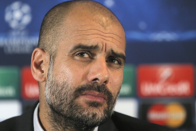 FC Bayern's head coach Pep Guardiola of Spain  attends a press conference  in Lviv, Western Ukraine, Monday, Feb. 16, 2015. FC Bayern Munich  will play against  FC Shakhtar Donetsk  in a Champions League Round of 16, First Leg match on Tuesday in Lviv. (AP Photo/Efrem Lukatsky)