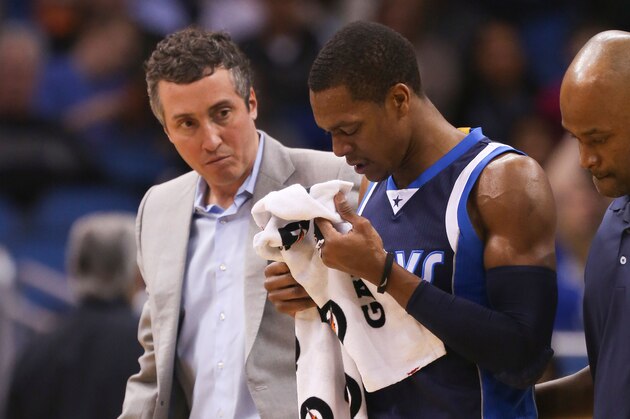 Jan 31, 2015; Orlando, FL, USA;  Dallas Mavericks guard Rajon Rondo (center) is assisted off the court by medical staff during the first quarter of an NBA basketball game at Amway Center. Mandatory Credit: Reinhold Matay-USA TODAY Sports
