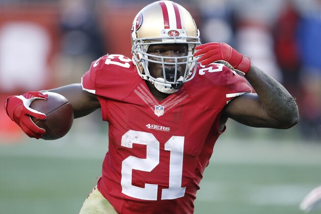 San Francisco 49ers running back Frank Gore (21) runs against the Arizona Cardinals during the fourth quarter of an NFL football game in Santa Clara, Calif., Sunday, Dec. 28, 2014. (AP Photo/Tony Avelar)