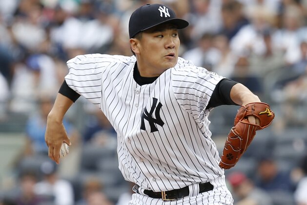 New York Yankees starting pitcher Masahiro Tanaka throws during the second inning of the baseball game against the Toronto Blue Jays at Yankee Stadium, Sunday, Sept. 21, 2014 in New York. (AP Photo/Seth Wenig)