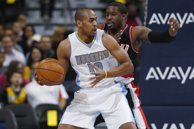 Denver Nuggets guard Arron Afflalo, front, tries to work the ball inside for a shot as Portland Trail Blazers guard Wesley Matthews covers in the first quarter of an NBA basketball game in Denver on Tuesday, Dec. 2, 2014. (AP Photo/David Zalubowski)