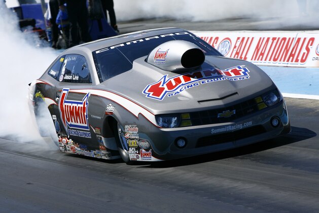 In this photo provided by NHRA, Pro Stock driver Jason Line performs a burnout before his final round matchup against Shane Gray on Sunday, Sept. 22, 2013, at the AAA Texas NHRA FallNationals at Texas Motorplex near Dallas. Line claimed his second victory of the season, knocking off Gray with a run of 6.590 seconds at 211.16 mph in his Summit Racing Equipment Chevy Camaro. Line also moved into the points lead for the first time since 2011 with the victory. (AP Photo/NHRA, Randy Anderson)