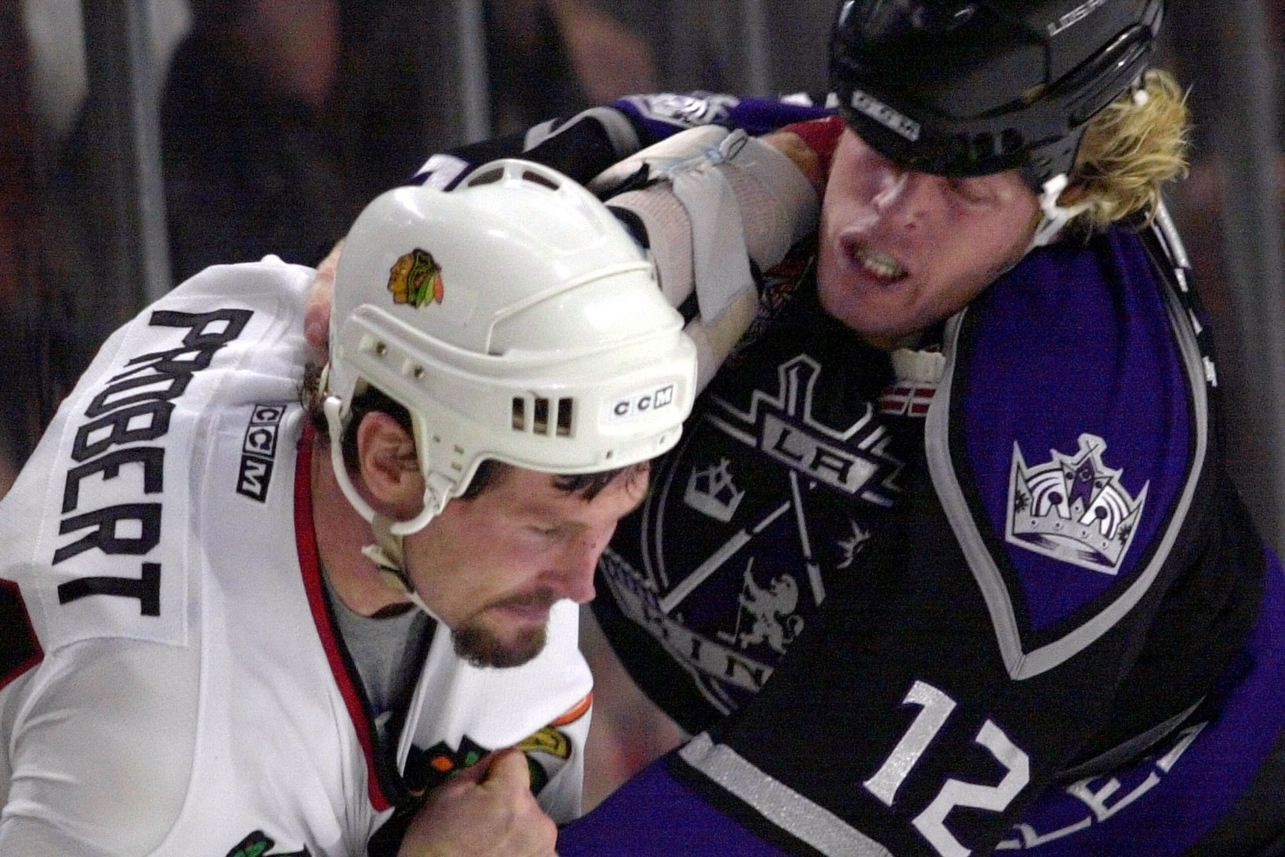 Chicago Blackhawks' Bob Probert (24) and Los Angeles Kings' Ken Belanger (12) mix it up in the third period Tuesday, Oct. 30, 2001, in Chicago. Both players got 5-minute penalties for fighting.  The Blackhawks won 5-1.  (AP Photo/Fred Jewell)
