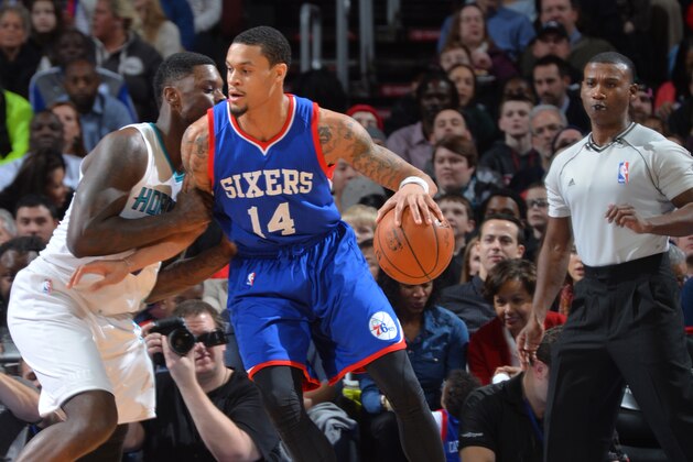 PHILADELPHIA, PA - FEBRUARY 7:  K.J. McDaniels #14 of the Philadelphia 76ers backs up to the basket against the Charlotte Hornets at Wells Fargo Center on February 7, 2015 in Philadelphia, Pennsylvania NOTE TO USER: User expressly acknowledges and agrees that, by downloading and/or using this Photograph, user is consenting to the terms and conditions of the Getty Images License Agreement. Mandatory Copyright Notice: Copyright 2015 NBAE (Photo by Jesse D. Garrabrant/NBAE via Getty Images)