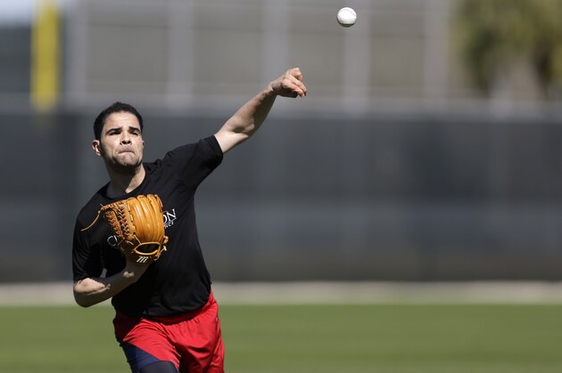 St. Louis Cardinals pitcher Jaime Garcia throws during spring training baseball practice Thursday, Feb. 19, 2015, in Jupiter, Fla. Cardinals pitchers and catchers have their first official workout scheduled for Friday. (AP Photo/Jeff Roberson)