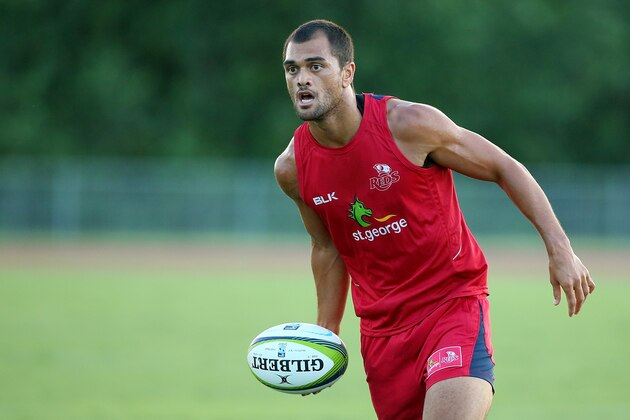 CAIRNS, AUSTRALIA - JANUARY 30:  Karmichael Hunt runs the ball during a Queensland Reds Super Rugby training session on January 30, 2015 in Cairns, Australia.  (Photo by Chris Hyde/Getty Images)
